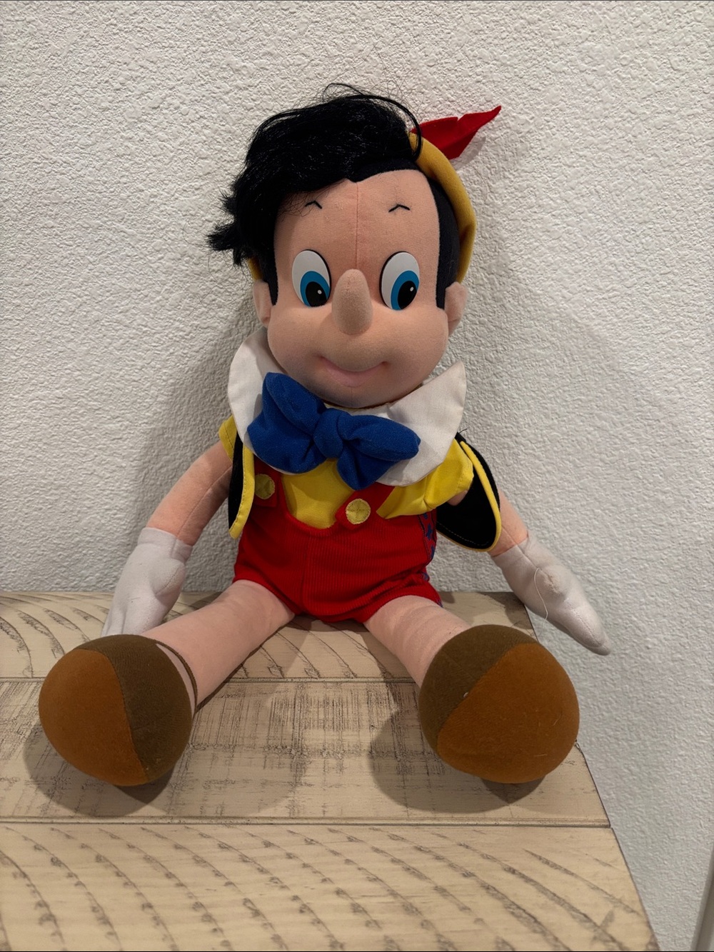 Classic Red Pinocchio Plush Doll with Blue Bow